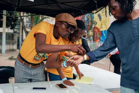 Ngeke! Festival 2025 attendees registering at the entrance.